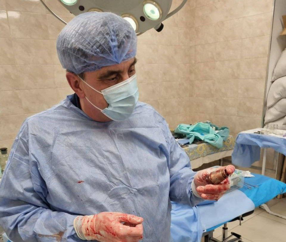 Unexploded grenade is removed from soldier's body military doctors and