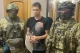 на фото: затриманий учасник злочинного угруповання